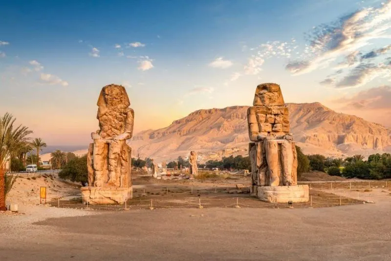 Admire the colossal statues of the Colossi of Memnon on your 8-Day Luxury Egypt Tours.